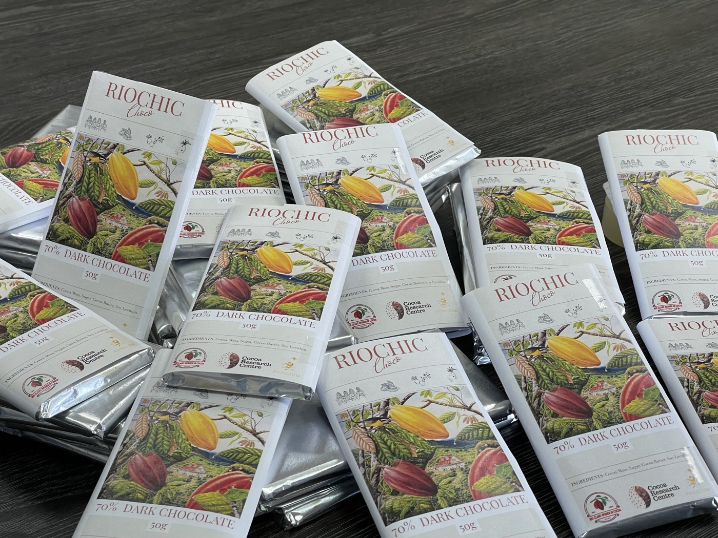 Stack of RIOCHIC Choco 70% dark chocolate bars, the CRC commercial line