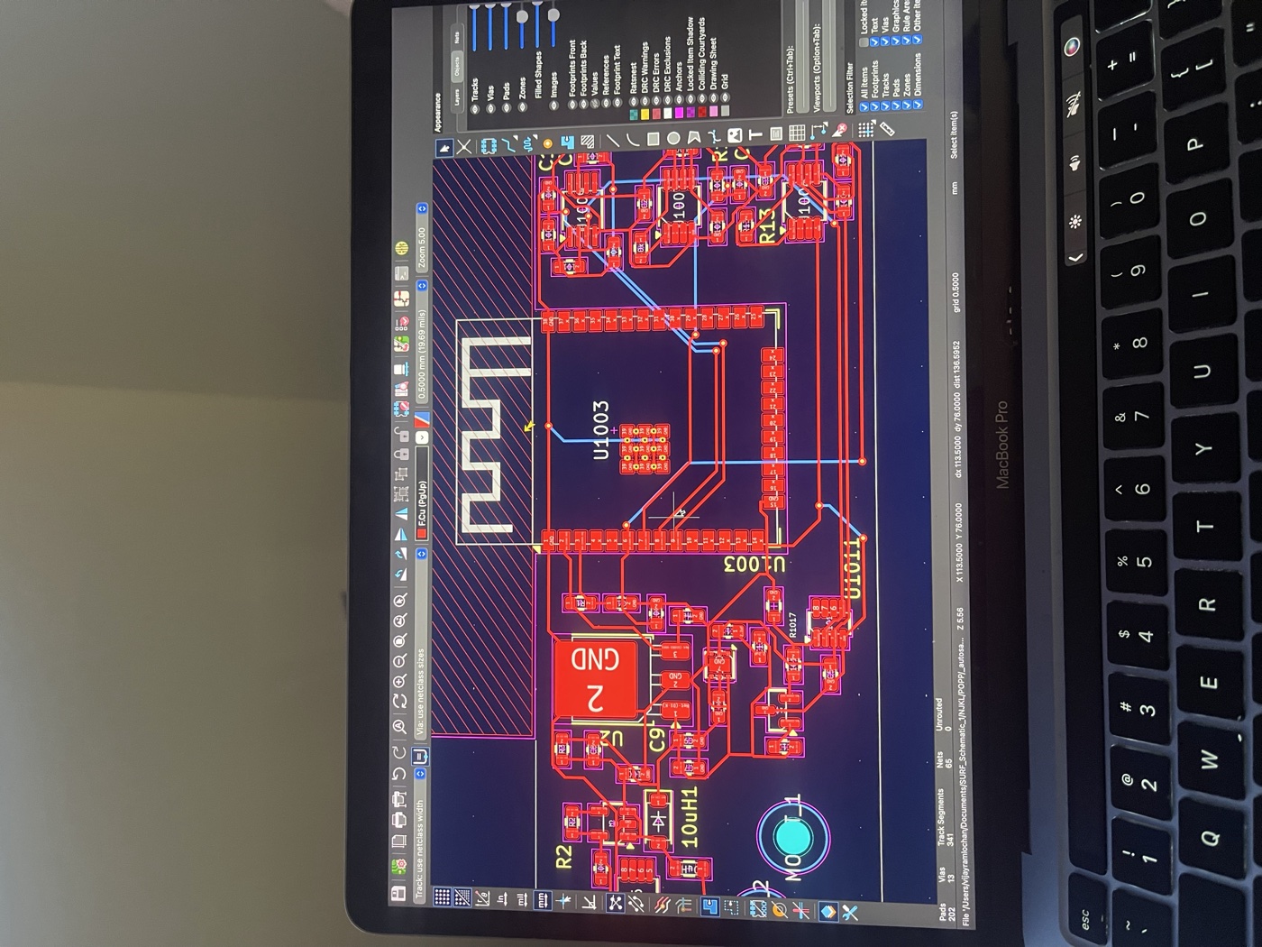 KiCad PCB layout open on MacBook